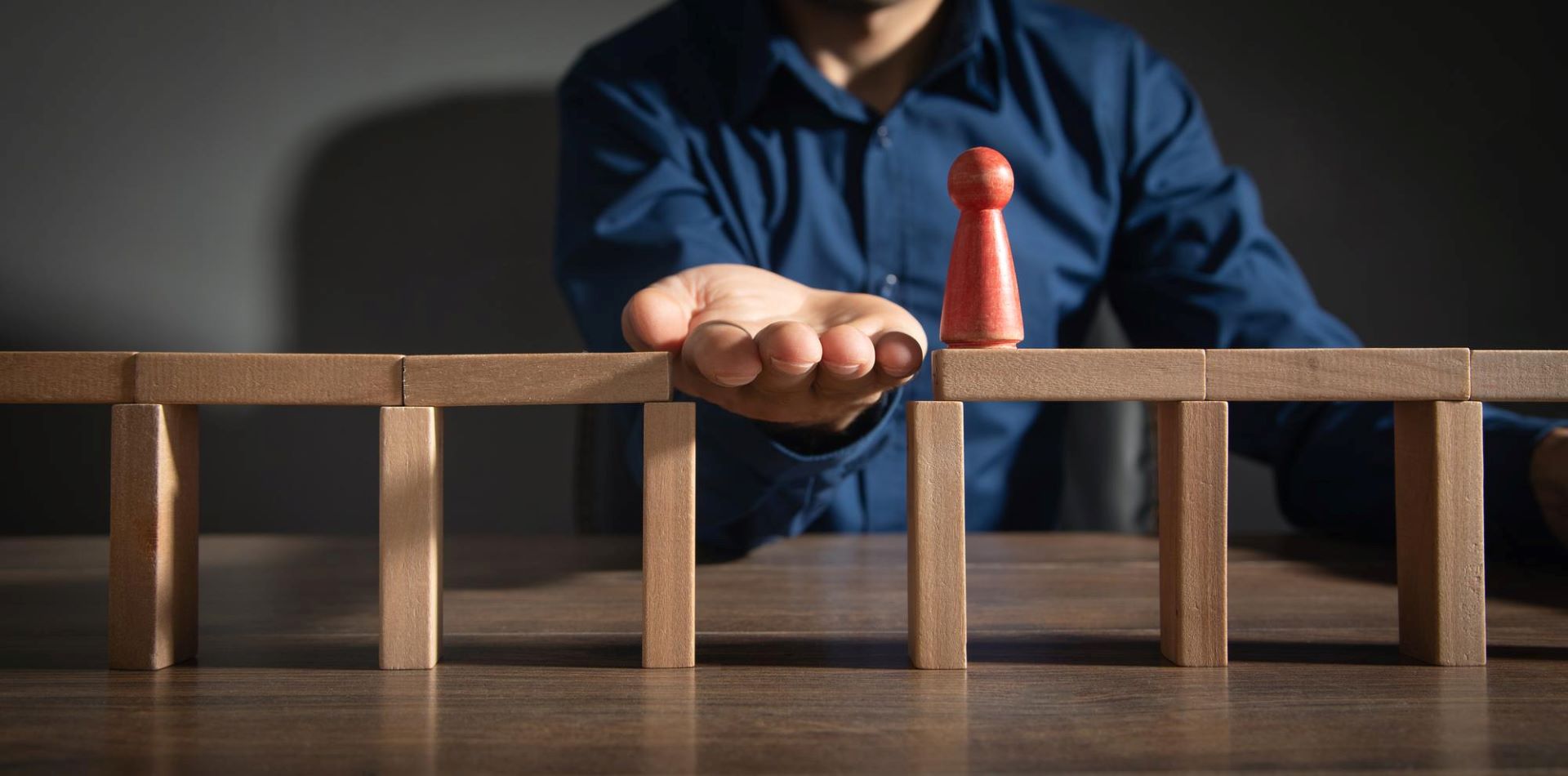 wooden blocks human figure walk across solving problems